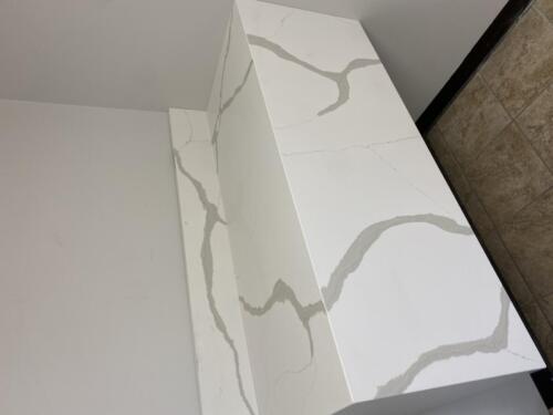 "Calacatta" One Quartz Daltile remnant waterfall floating 