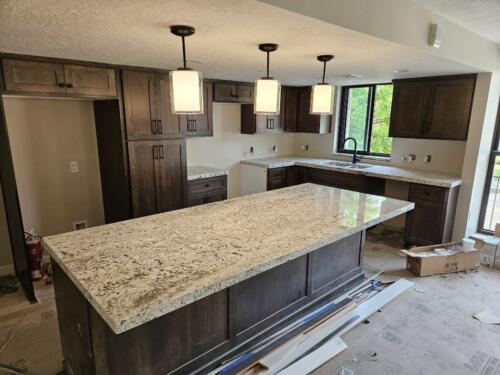 "Biscotti White" Granite from Daltile with 2-1/2" Mitered special edge profile installed in Salt Lake