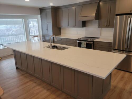 White Quartz Kitchen with oversized Island